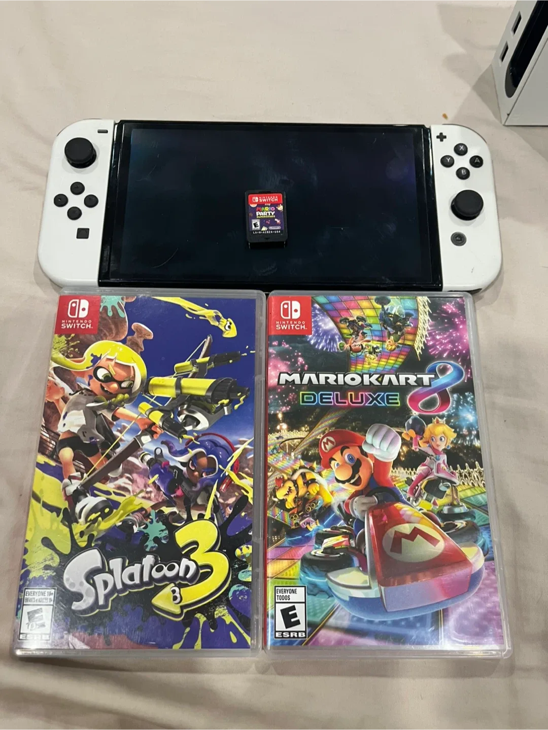 Nintendo Switch OLED with charging cable, doc, and games!