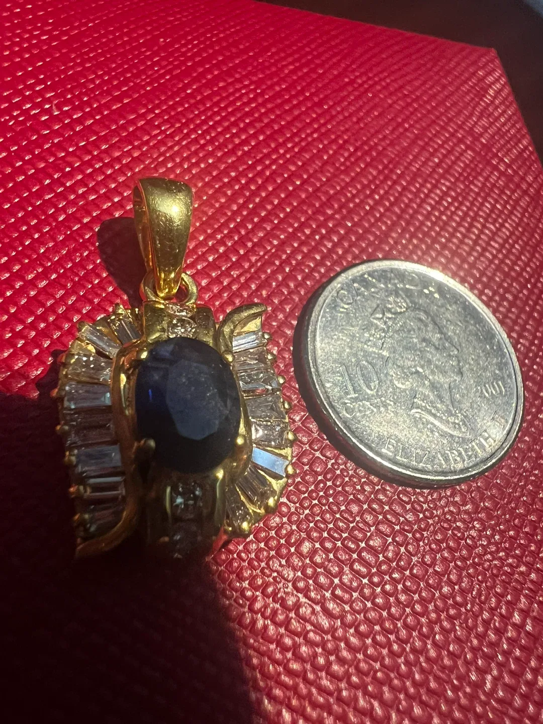 14 k Gold Pendant with sapphire and diamonds p.