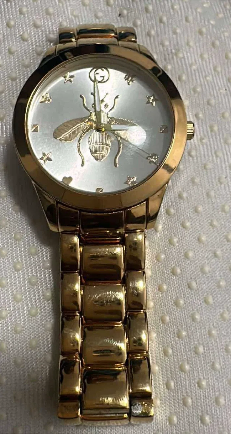 Michael Kors & Gucci Gold Watches image indicator(3)