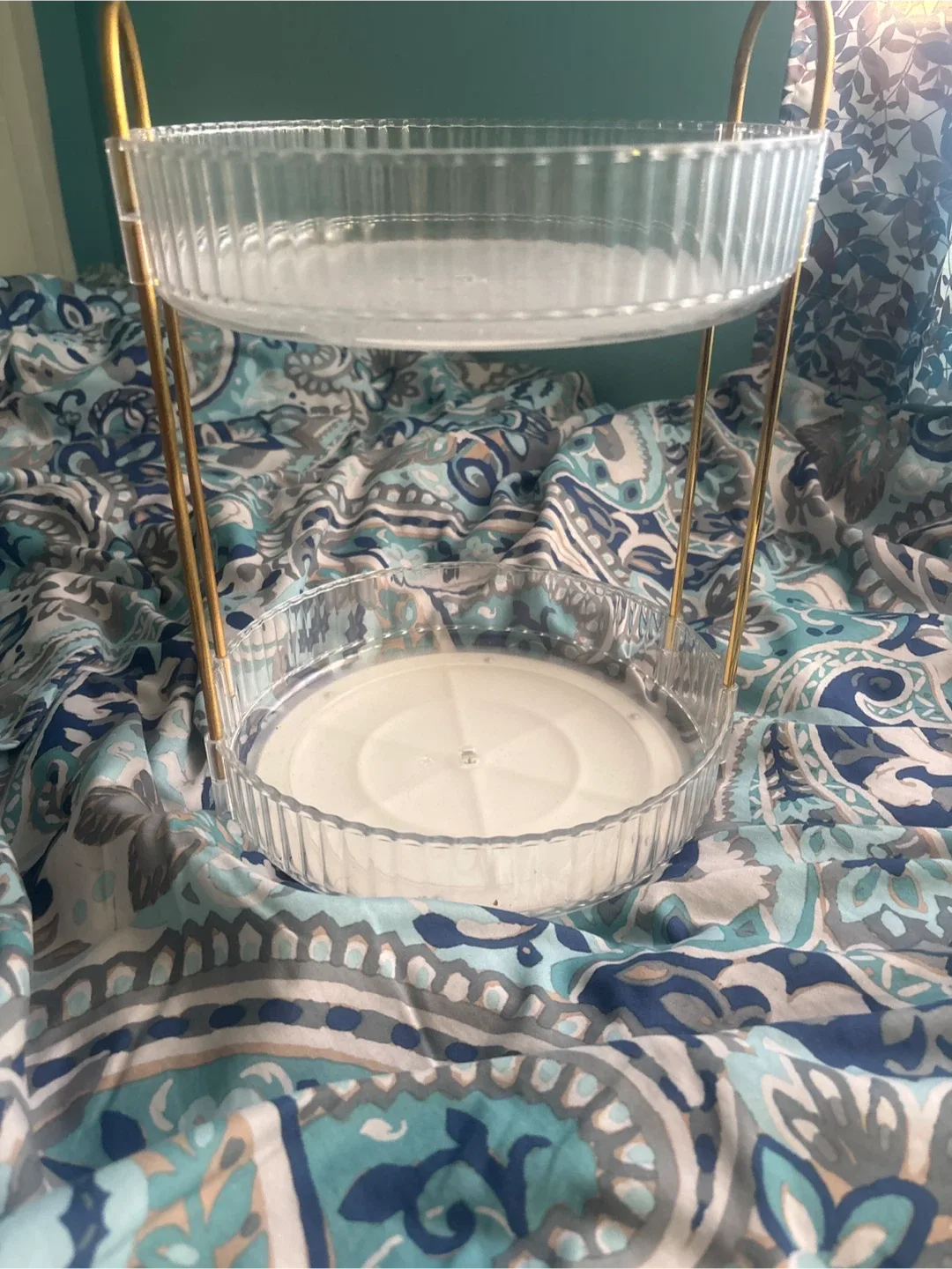 Gold and clear Vanity organizer that spins.