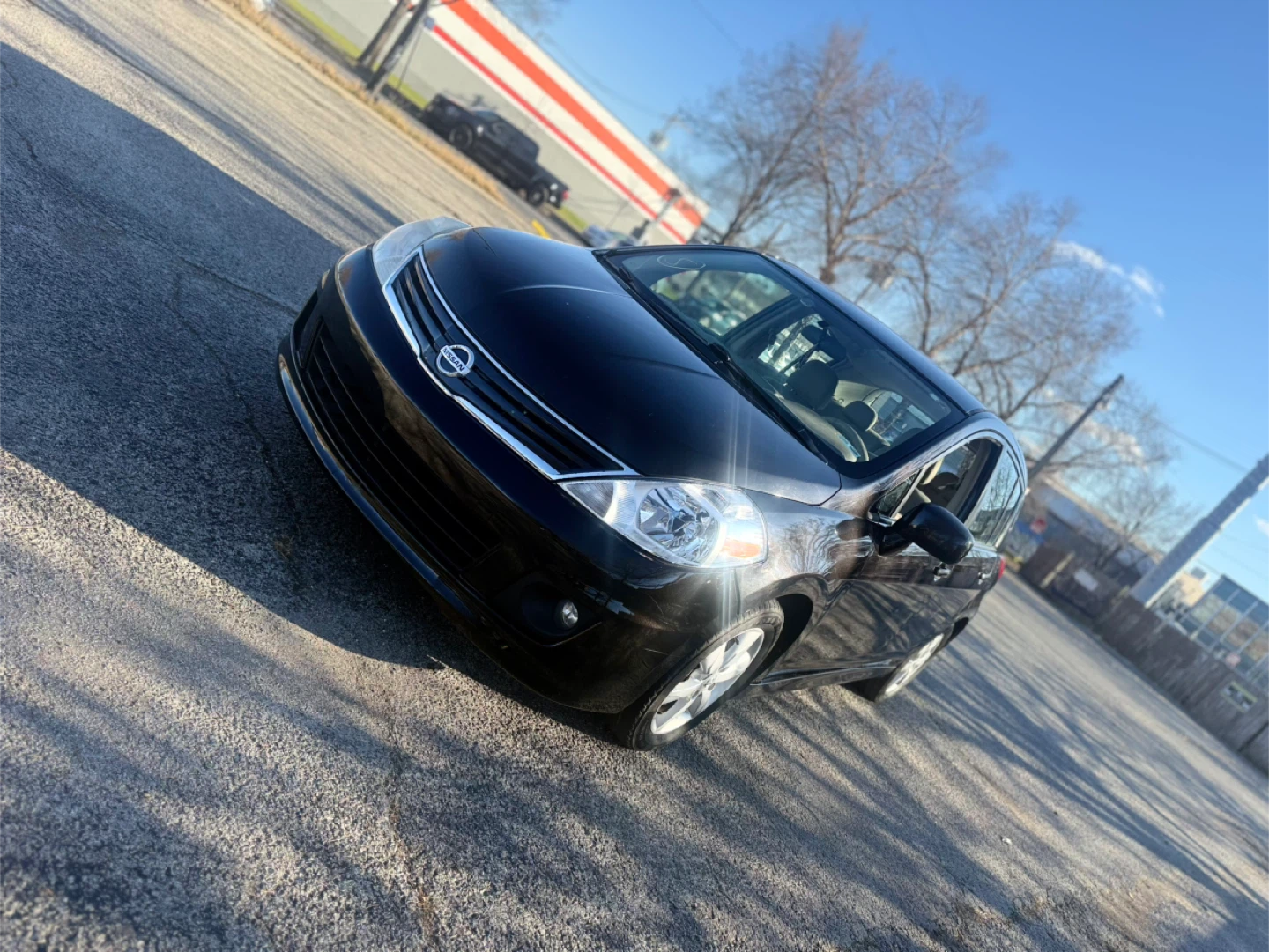 Black Nissan Versa SL Hatchback