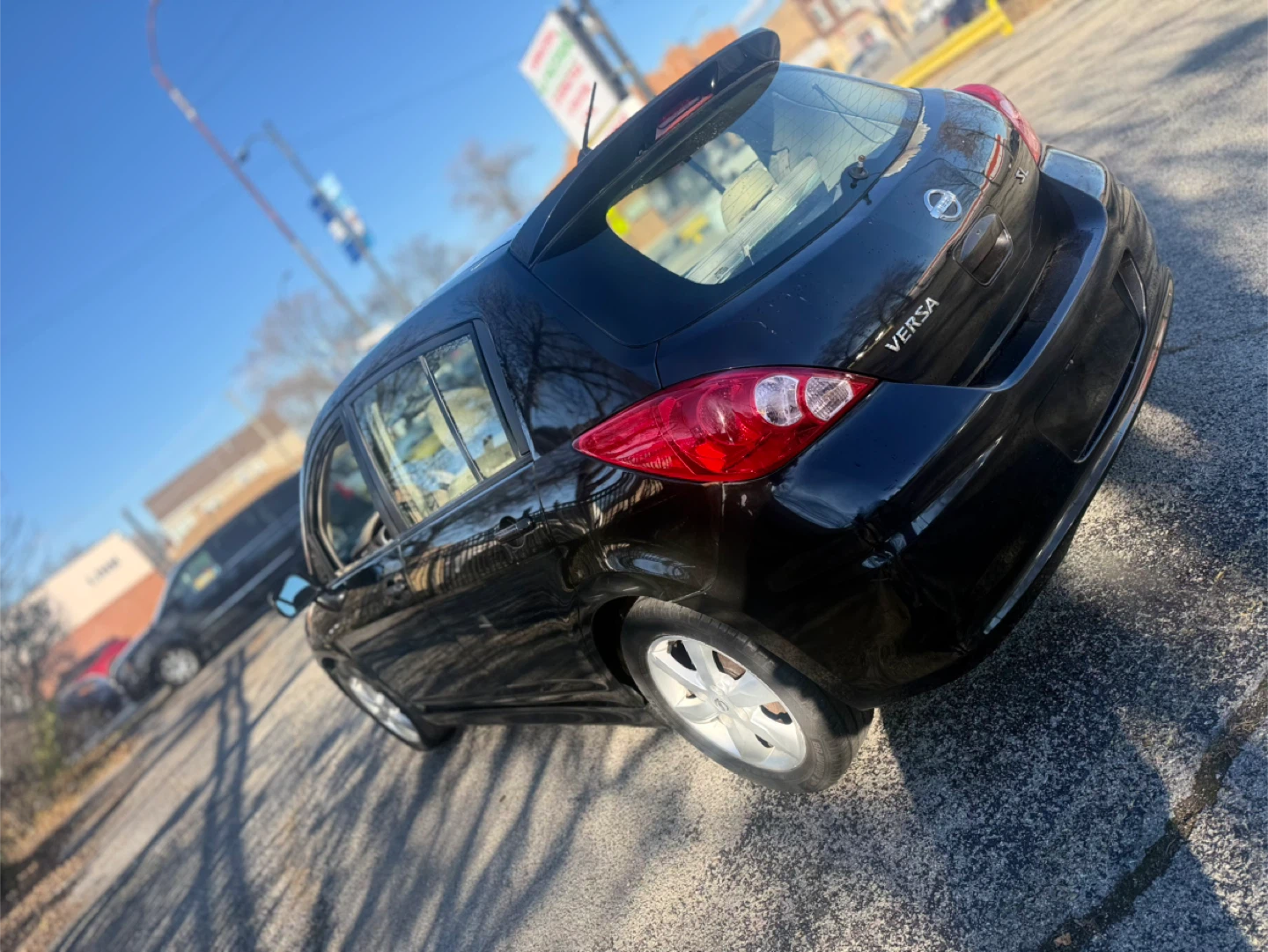 Black Nissan Versa SL Hatchback - photo 2