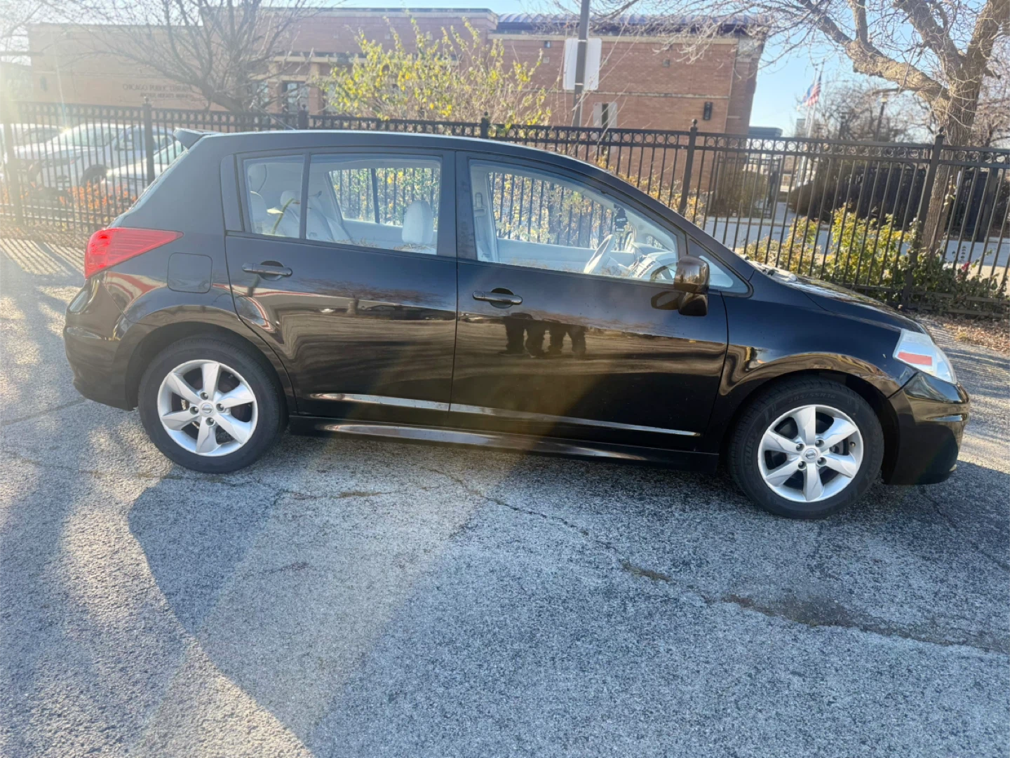 Black Nissan Versa SL Hatchback - photo 4