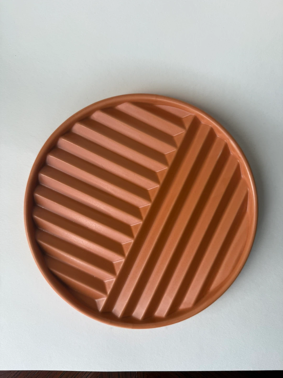 OUI terracotta-colour trivet