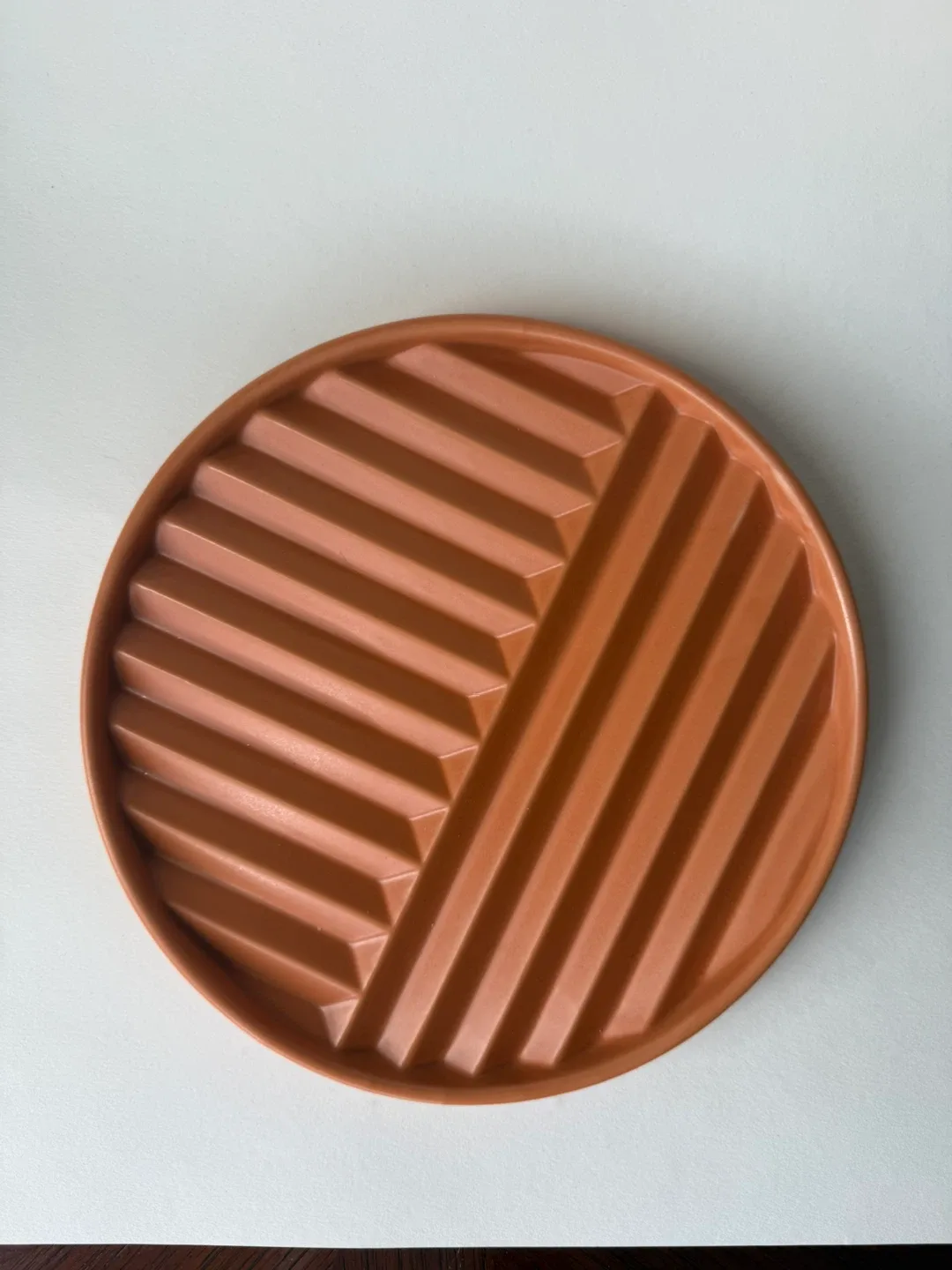 OUI terracotta-colour trivet
