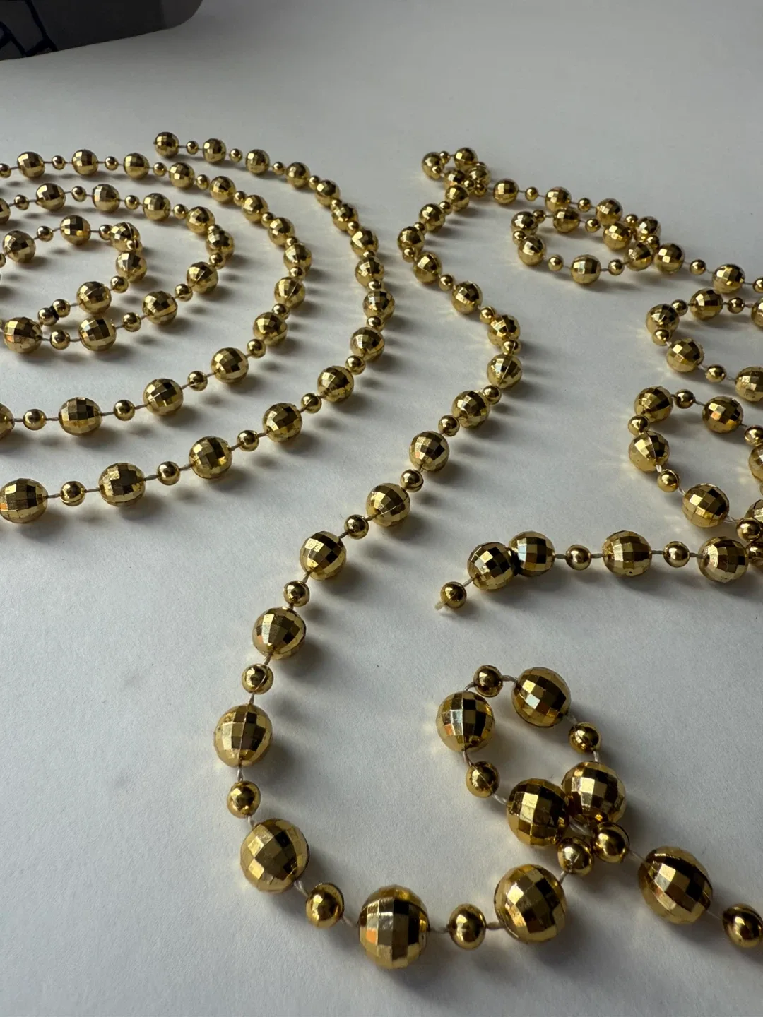 x2 small gold “disco ball” garlands