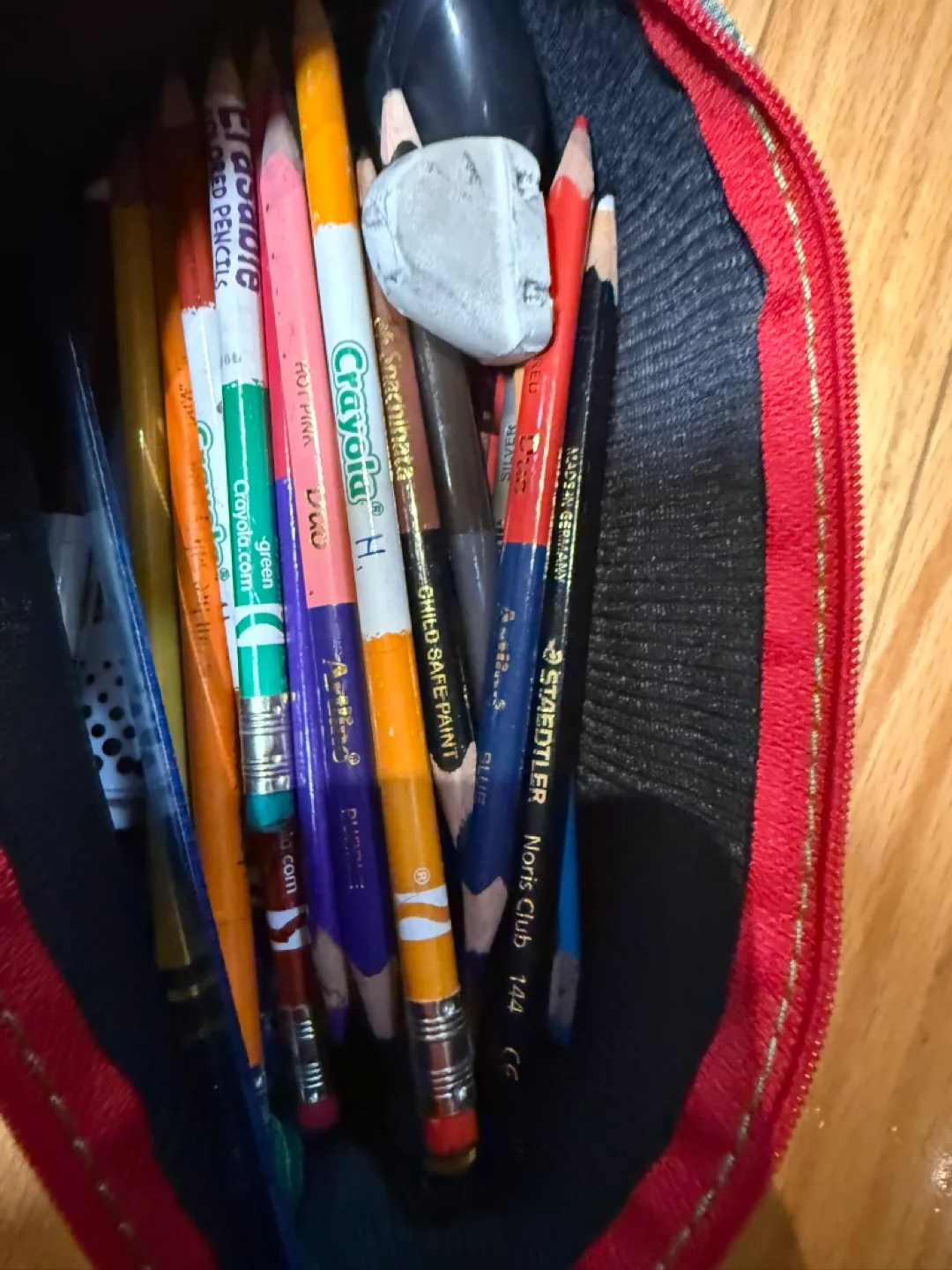 Pencil case with pencils and domino game image indicator(2)