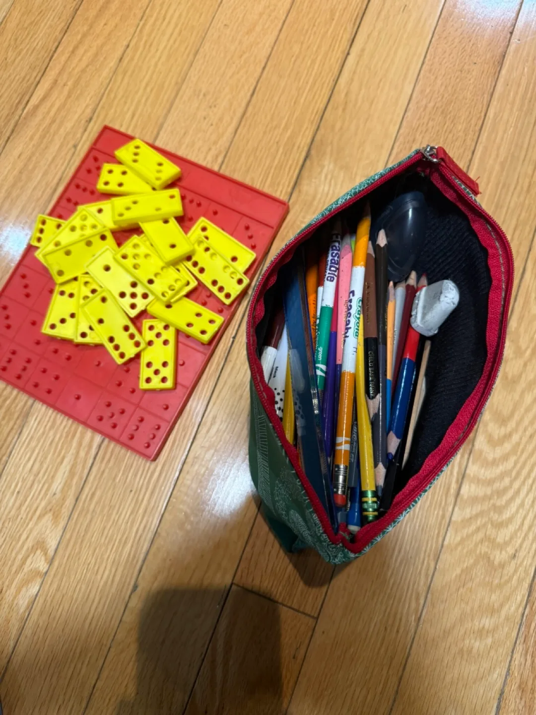 Pencil case with pencils and domino game