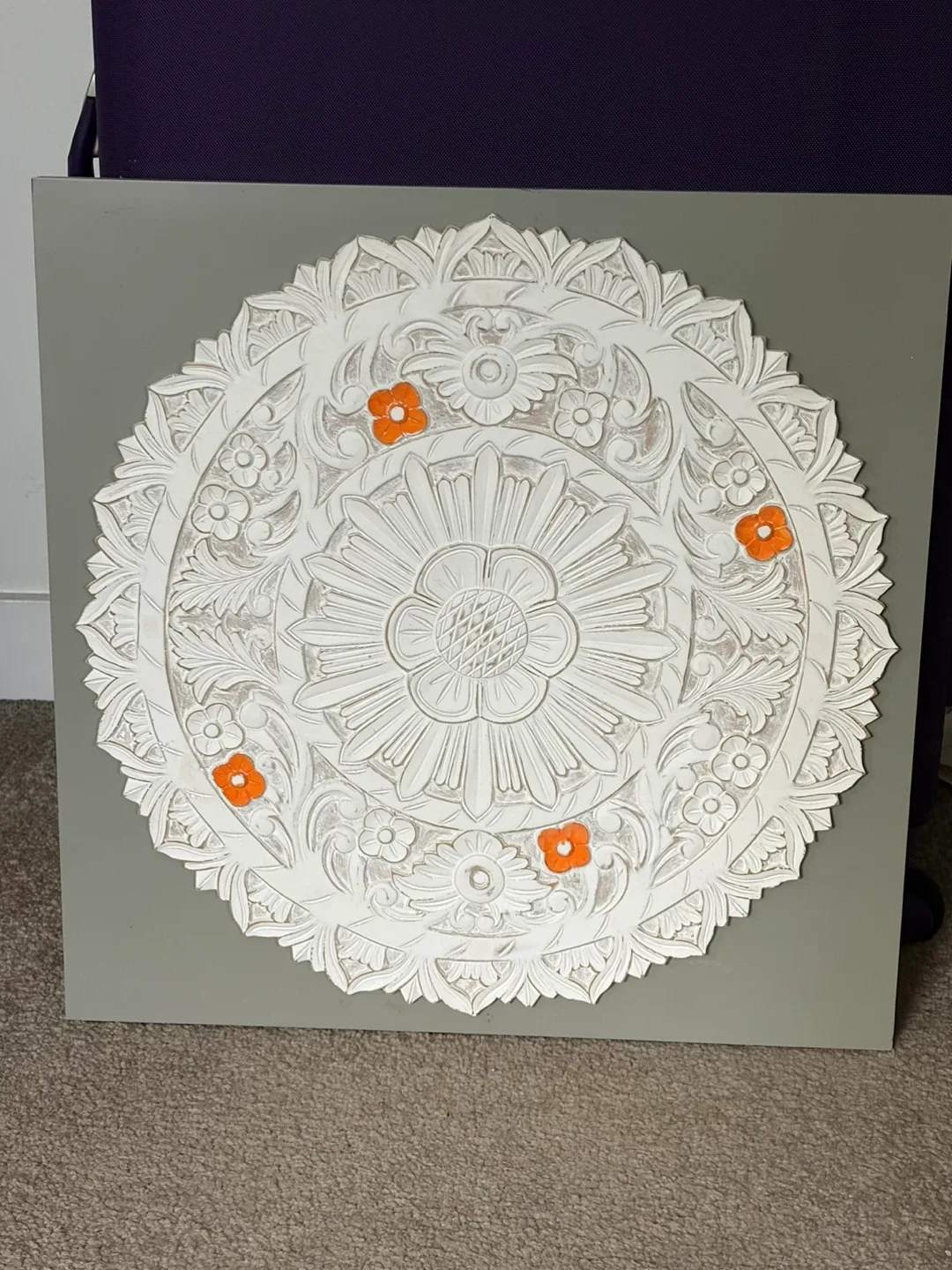 white, round, carved decorative ceiling medallion