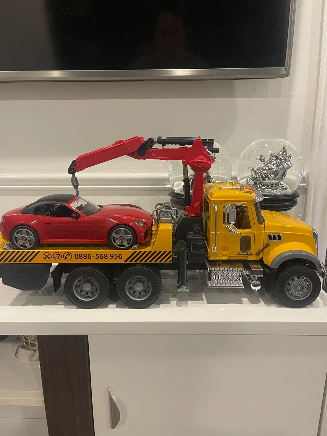 Bruder Mack Granite tow truck and Roadster car