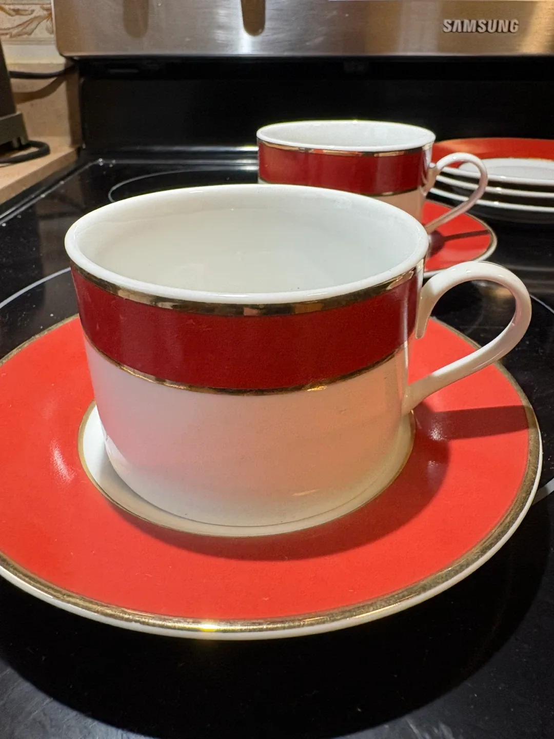 Red & White with gold trim. Cup and Saucer Set image indicator(3)