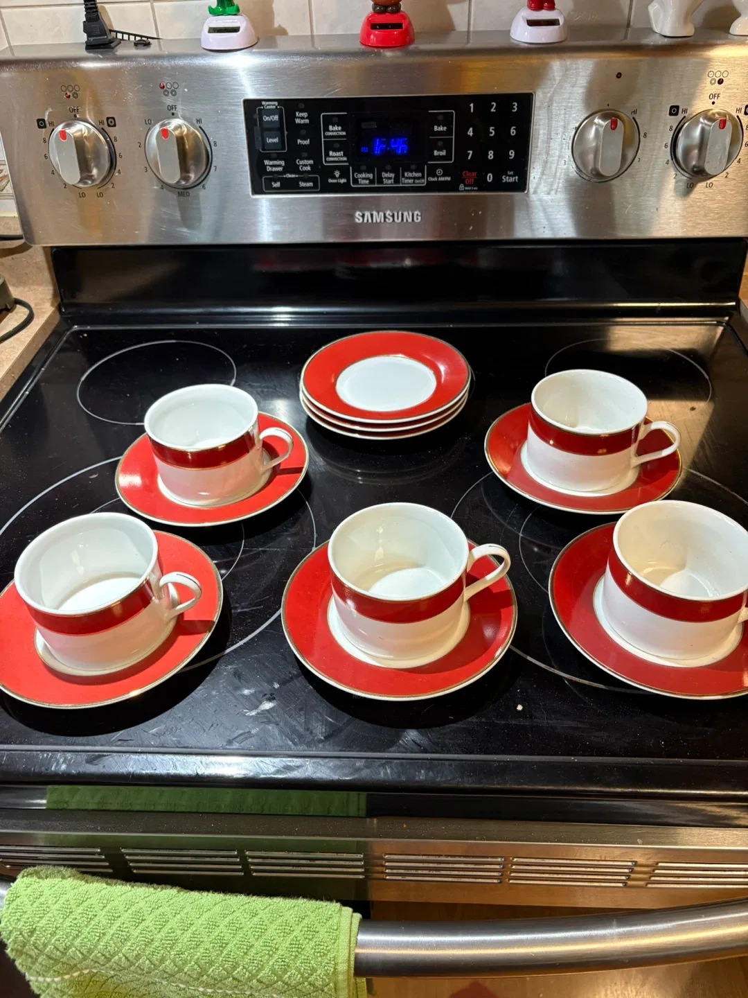 Red & White with gold trim. Cup and Saucer Set