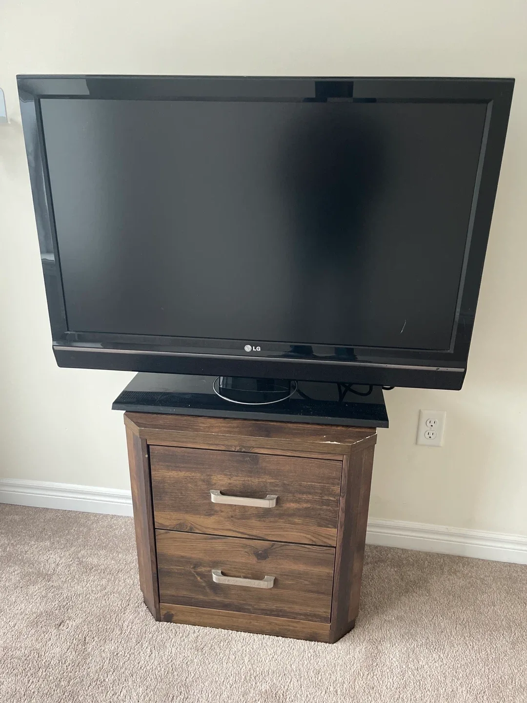 LG TV on Wooden Stand