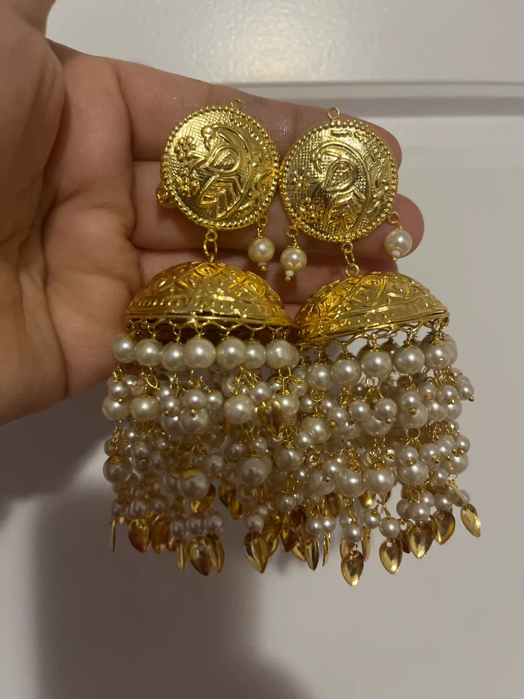 Gold Jhumka Earrings with Pearls image indicator(2)