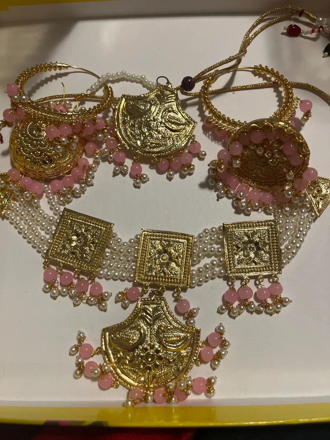 Gold Jhumka Earrings with Pink Beads