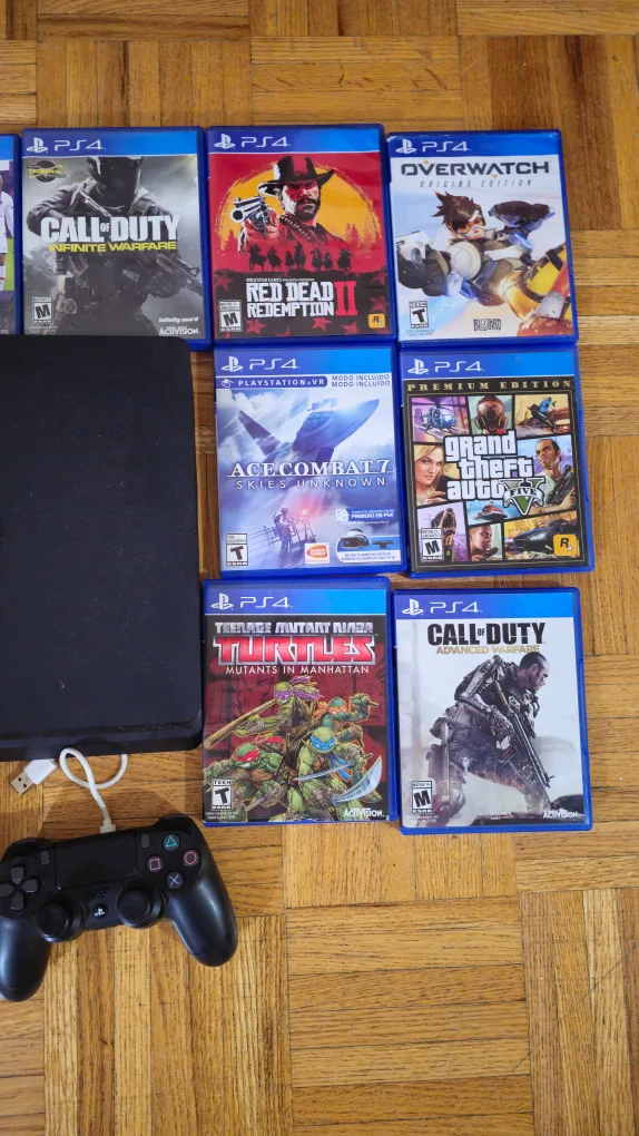 PlayStation 4 with Games and Controllers image indicator(3)