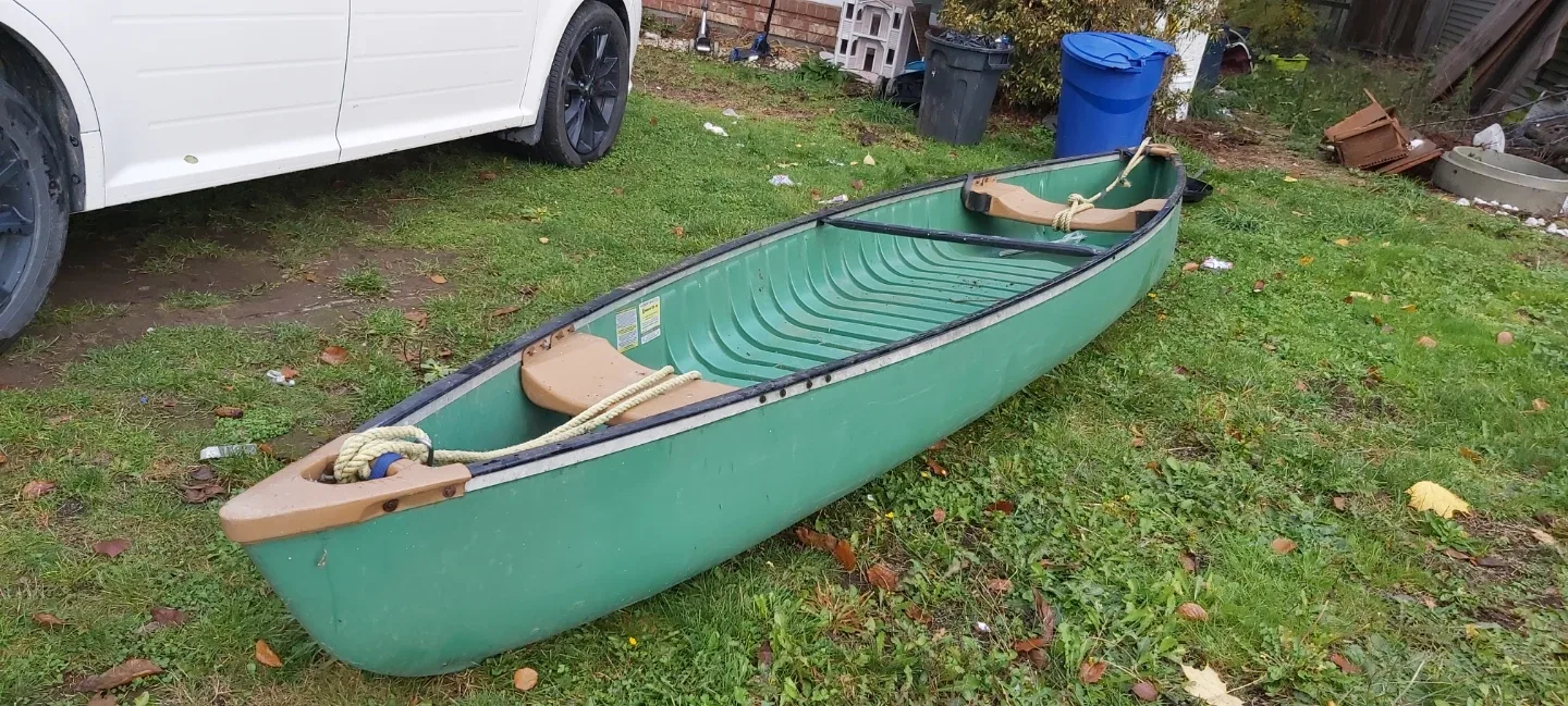 Green Pelican Canoe with Paddles