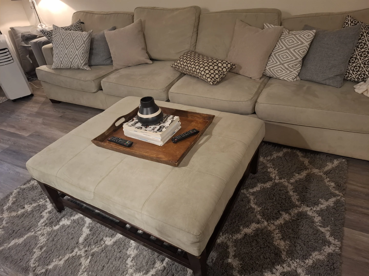 Beige Sectional Sofa with Pillows and table