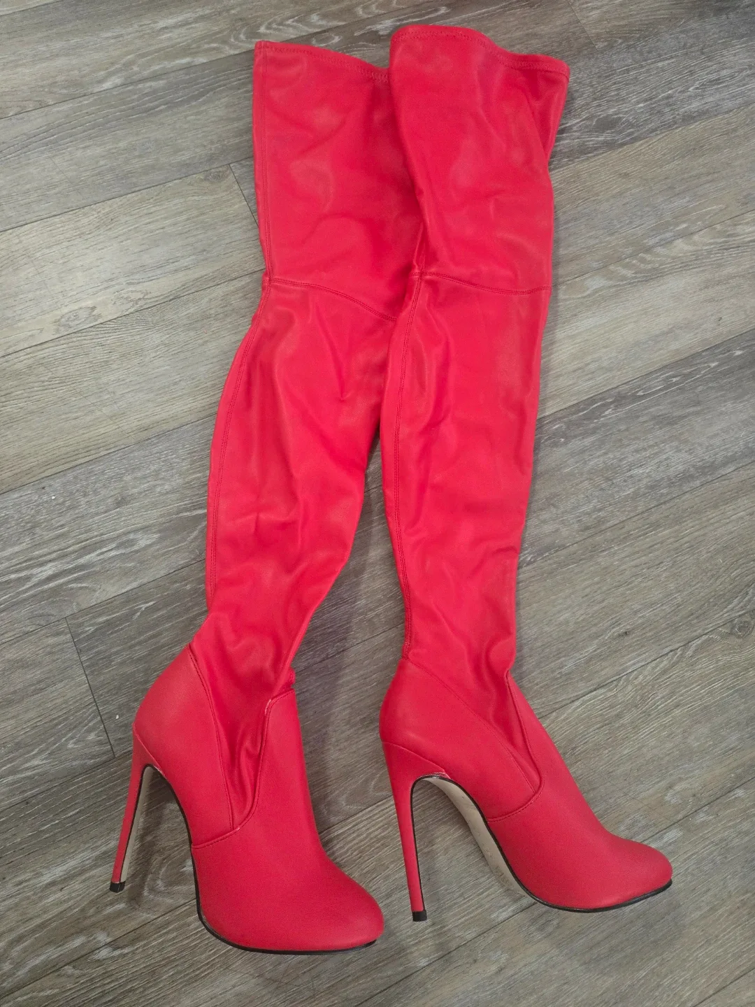 Thigh high red stiletto boots image indicator(2)