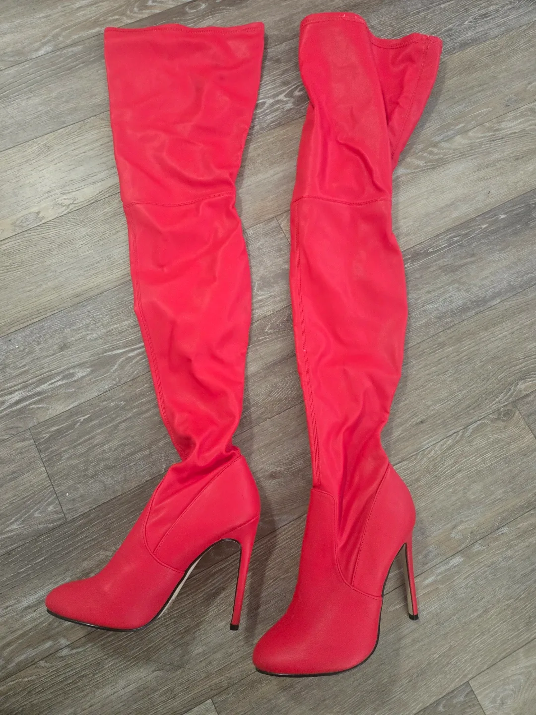 Thigh high red stiletto boots image indicator(3)