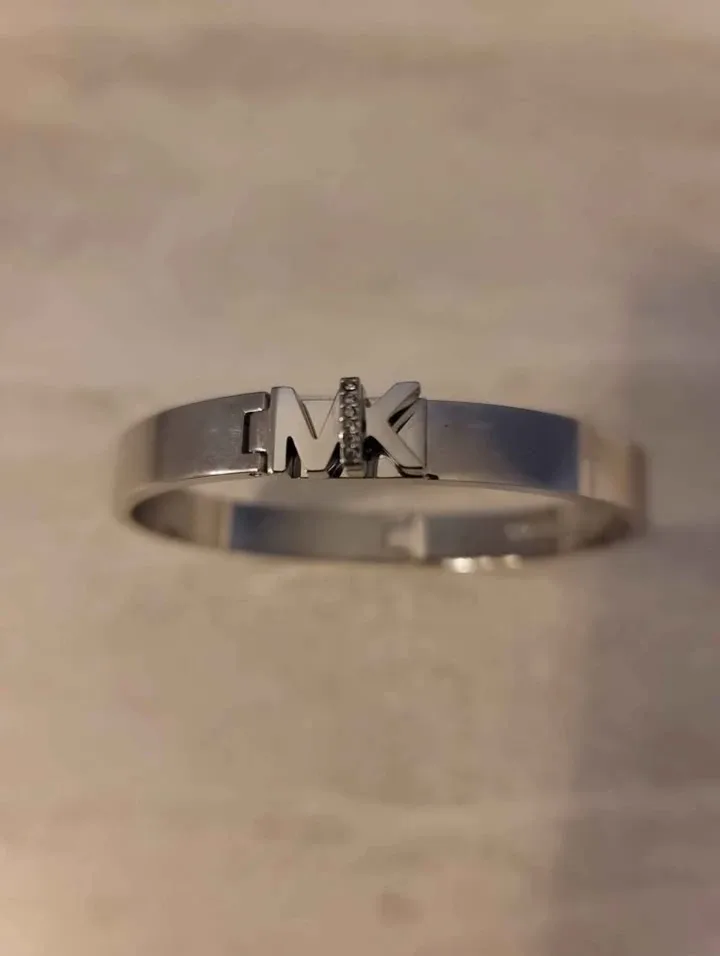 MK logo bangle bracelet in stainless steel with pavé crystals.  image indicator(2)