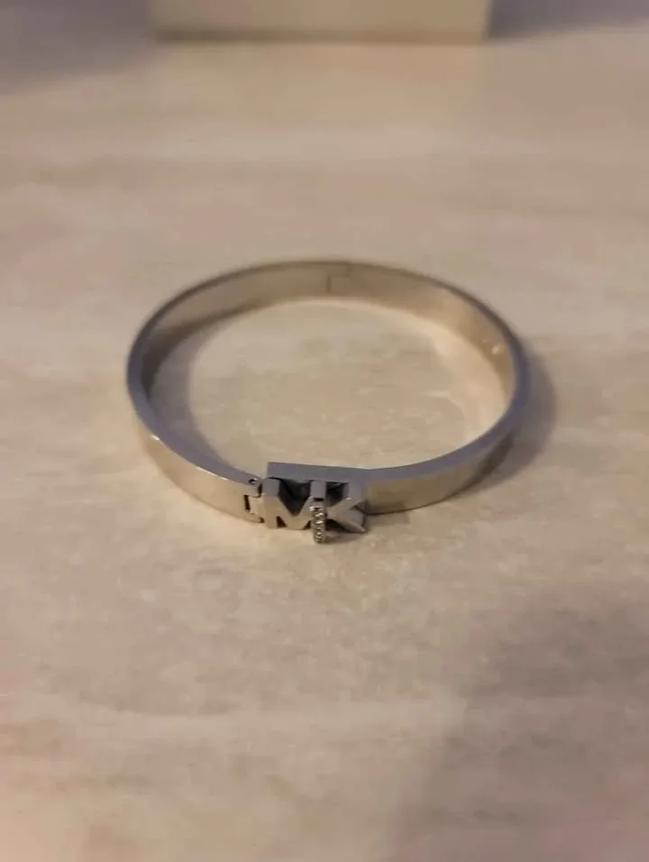 MK logo bangle bracelet in stainless steel with pavé crystals.  image indicator(3)