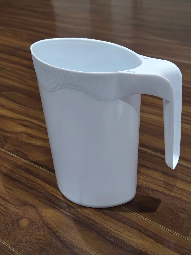 White Plastic Measuring Cup