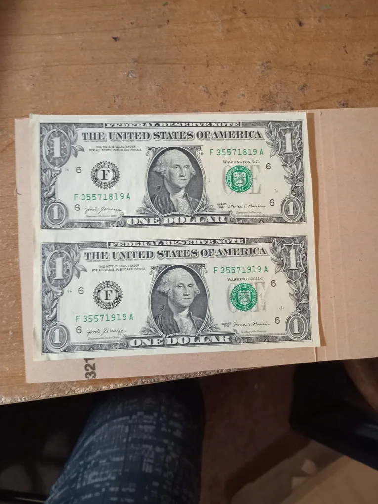 Attached One Dollar USD Bills