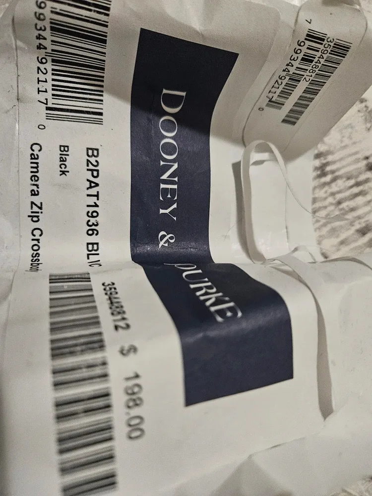 Dooney and Bourke cross body camera bag. image indicator(3)