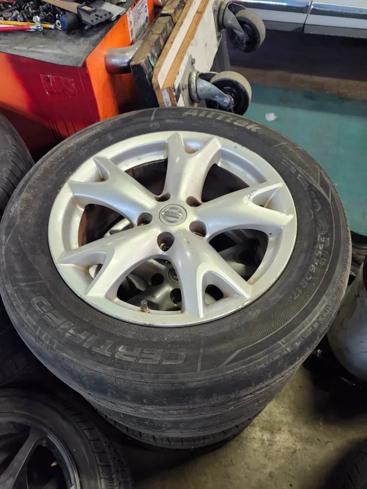 Set of 4 225/60R17 Tires on Nissan Rims