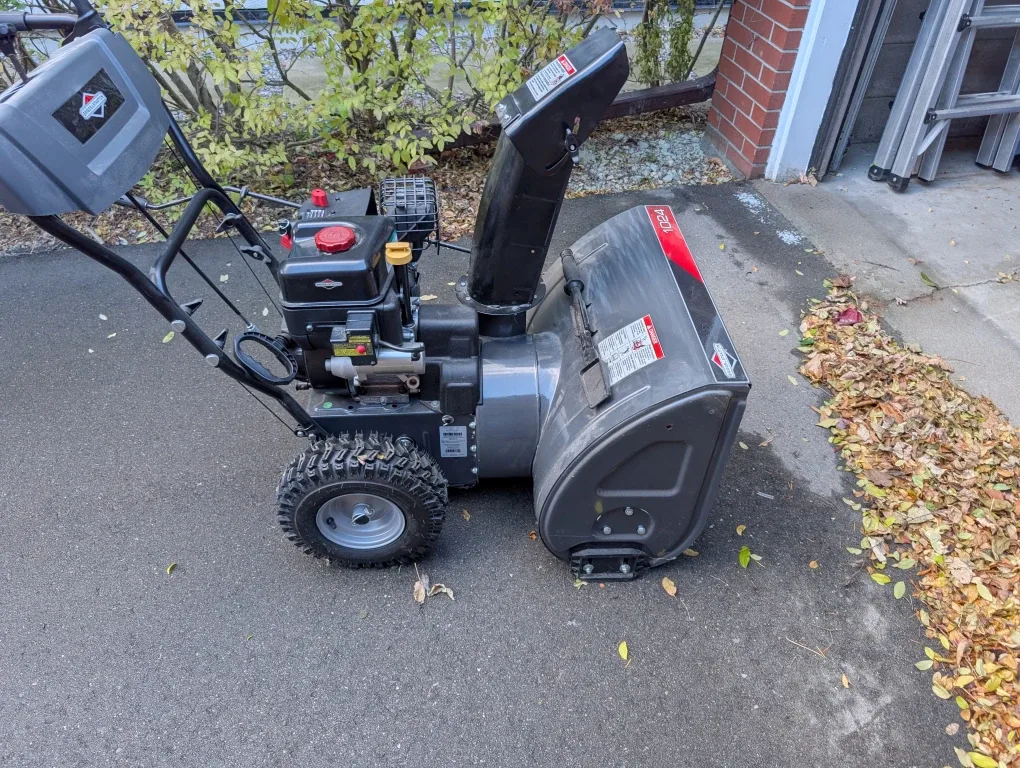 24" Briggs and Stratton gas snow blower - basically new