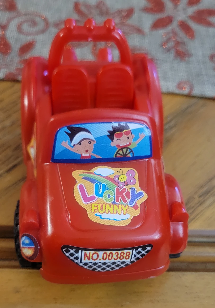 Red plastic toy car