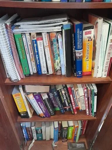 Bookshelf with Assorted Books image indicator(3)