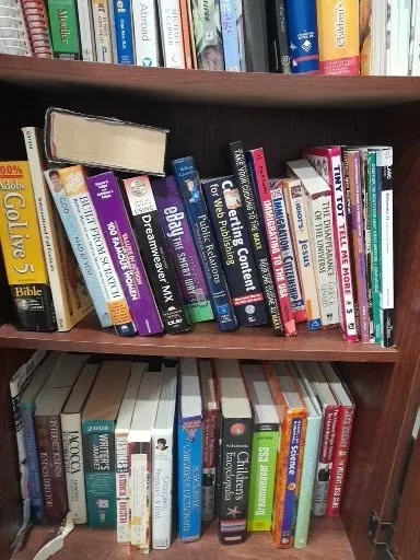 Bookshelf with Assorted Books image indicator(4)