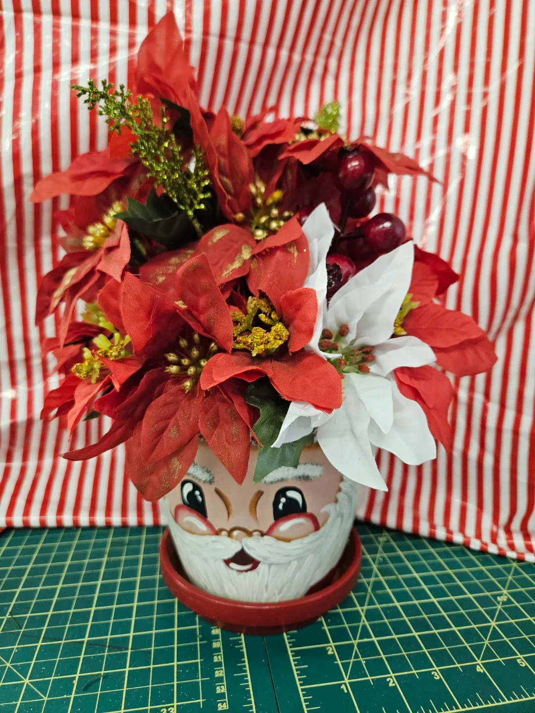 Santa Face Flower Pot with Poinsettias