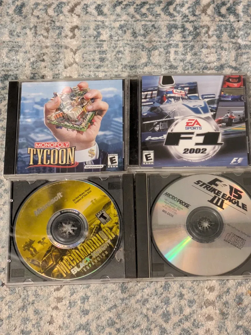 Mixed Lot of PC Games - Tiger Woods PGA Tour, Sims image indicator(3)