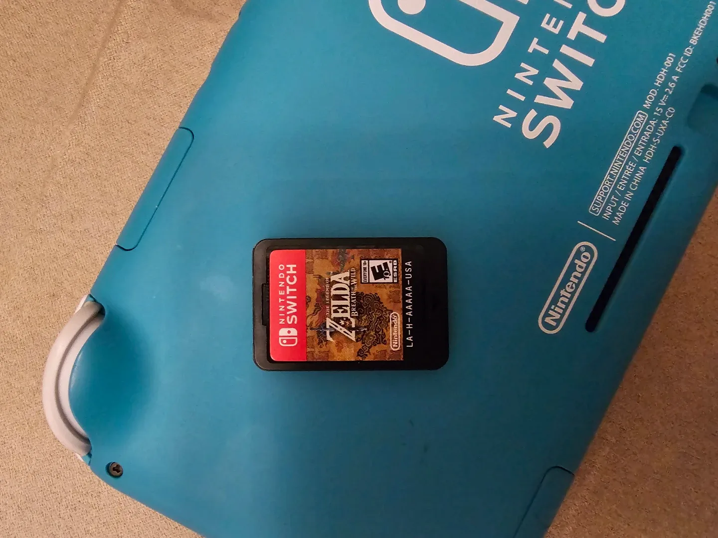 Nintendo Switch Lite (Turquoise) + Zelda Game image indicator(3)