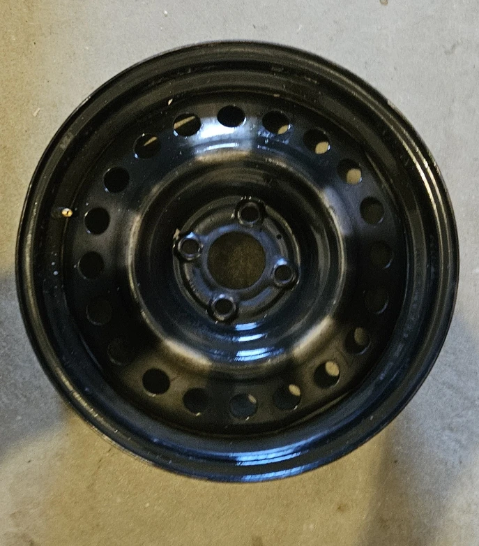 Steel Rims 4 x 100 with Nissan Hubcaps
