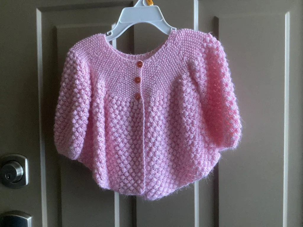 Girls sz 12 months sweaters, $3 each image indicator(2)