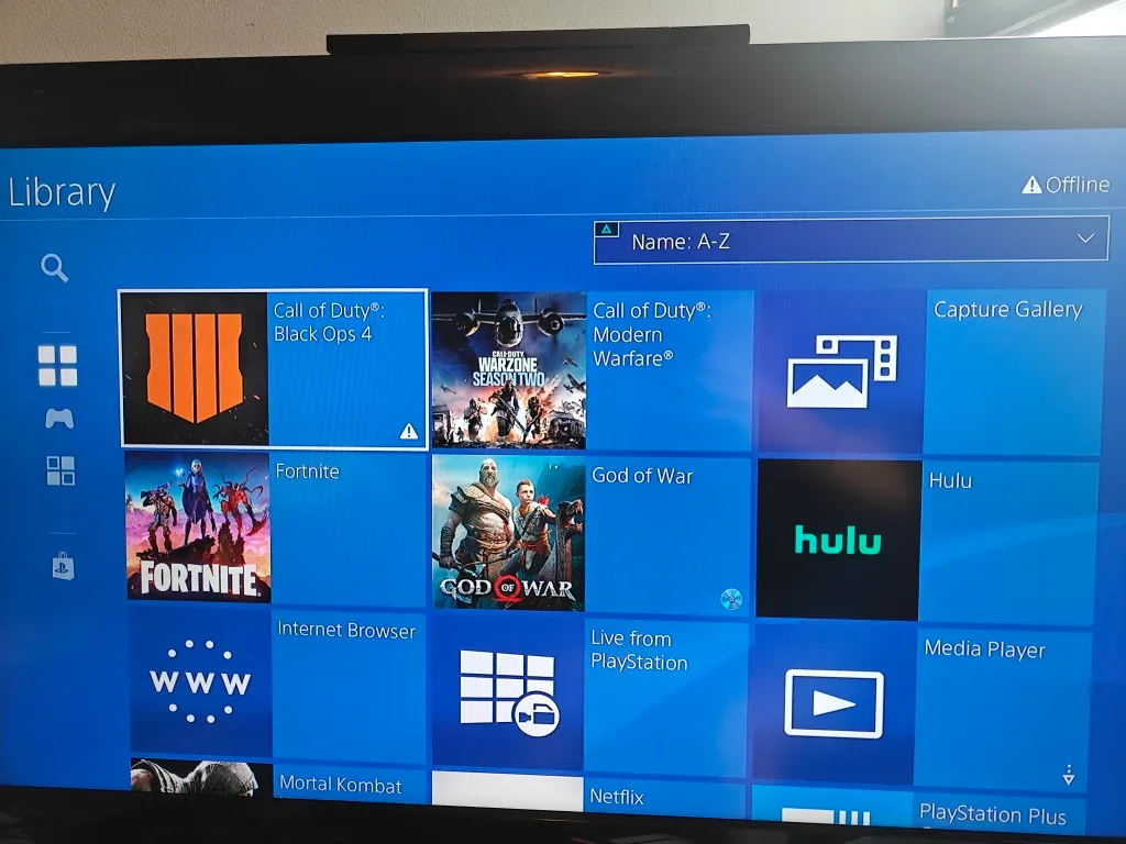 PS4 white with a controller and games image indicator(3)