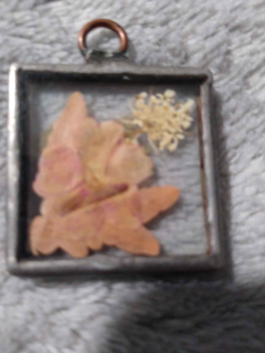 Beautiful encased dried flower pendant