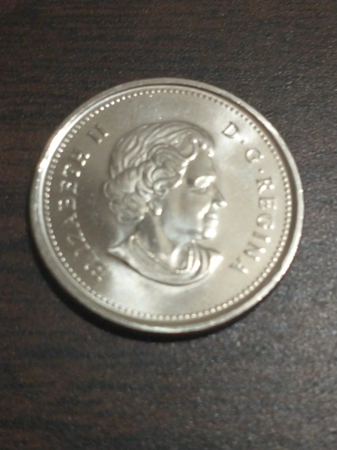 Beautiful 2010 Canada uncirculated colourized quarter KM #1028 image indicator(2)