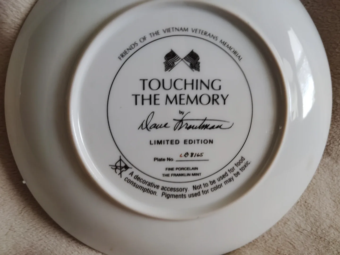 Touching the Memory Vietnam Veterans Memorial Plate image indicator(3)