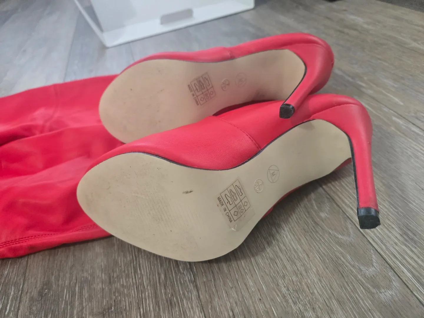 Thigh high red stiletto boots image indicator(4)