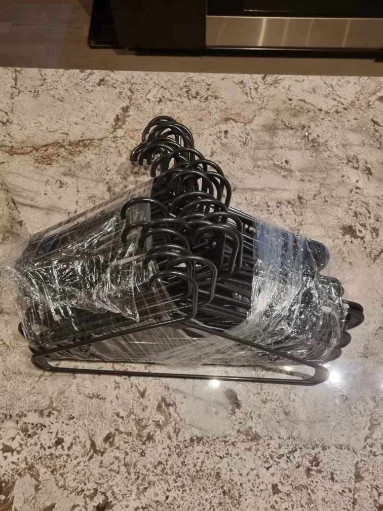 39 standard black plastic hangers. image indicator(2)