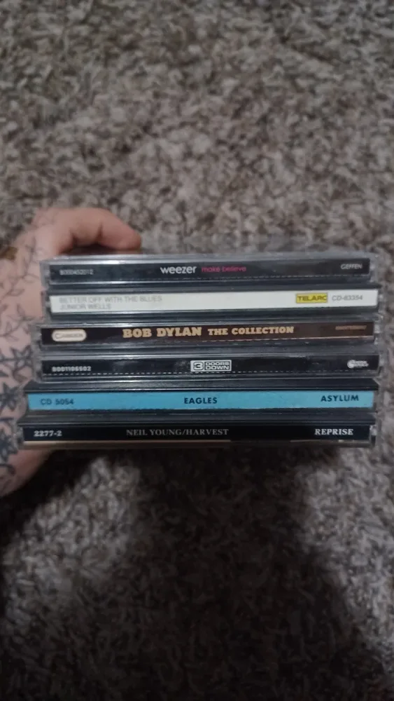 Mixed CD Collection: Bob Dylan, 3 Doors Down, Eagles, Weezer