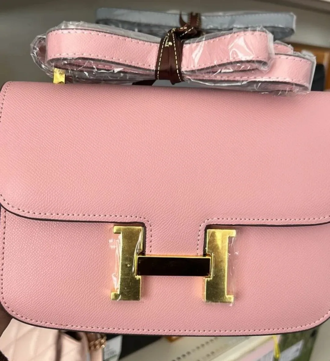 Pink Handbag with 'H' Logo