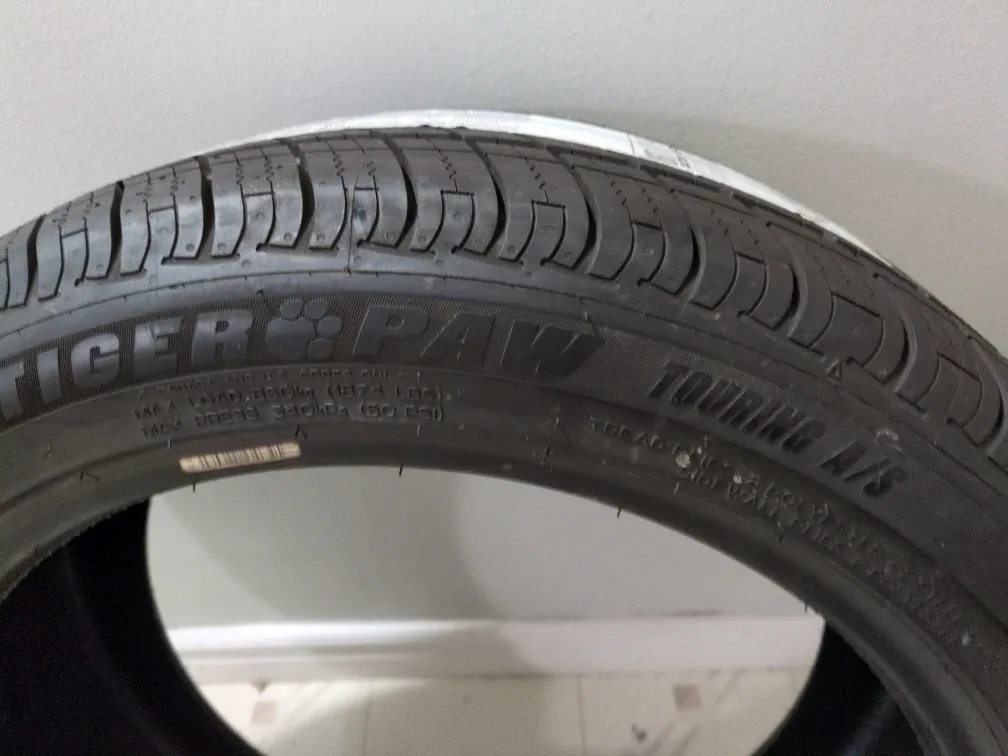 2 Uniroyal Tiger Paw Touring A/S 245/45R19 Tire image indicator(2)