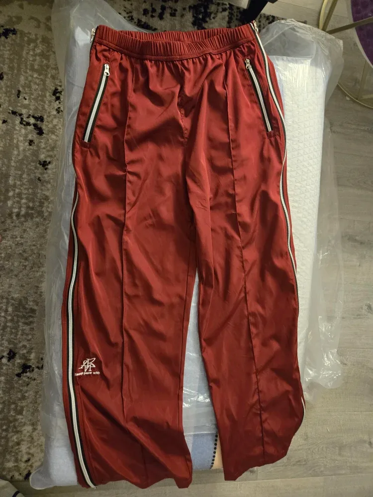 Men Keep Pace With Red Track Pants