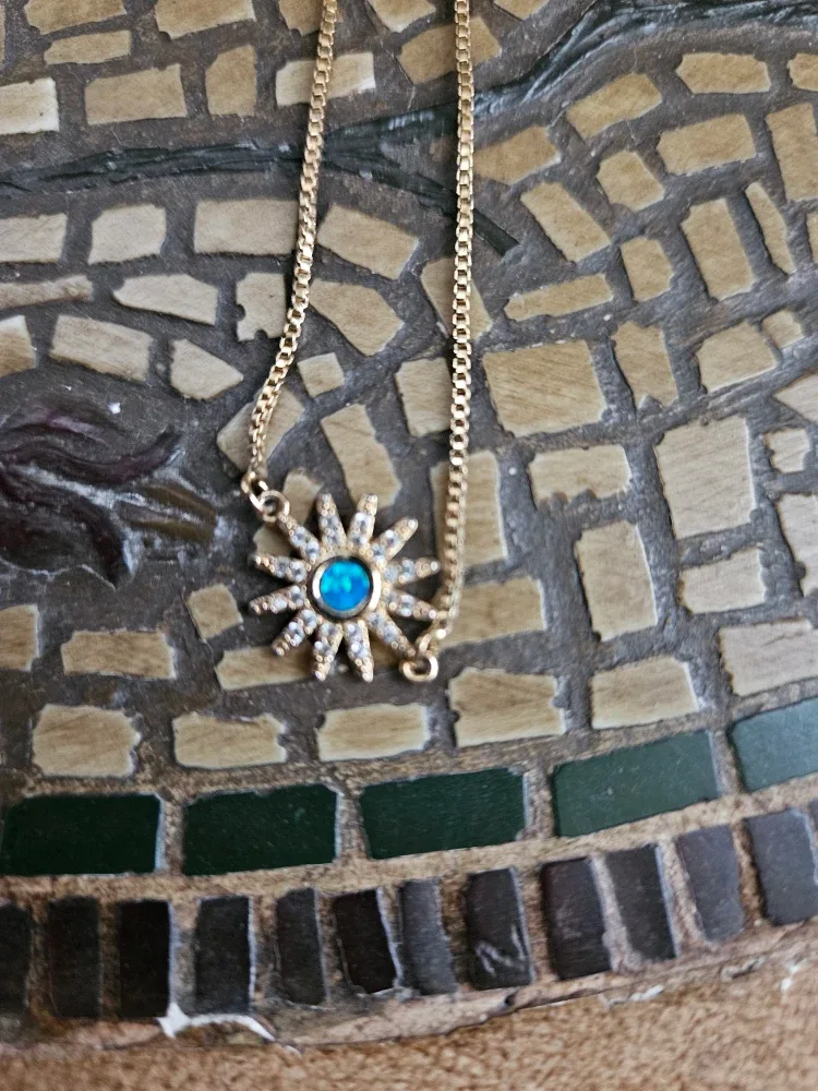 Gold Tone Sunburst bracelet.